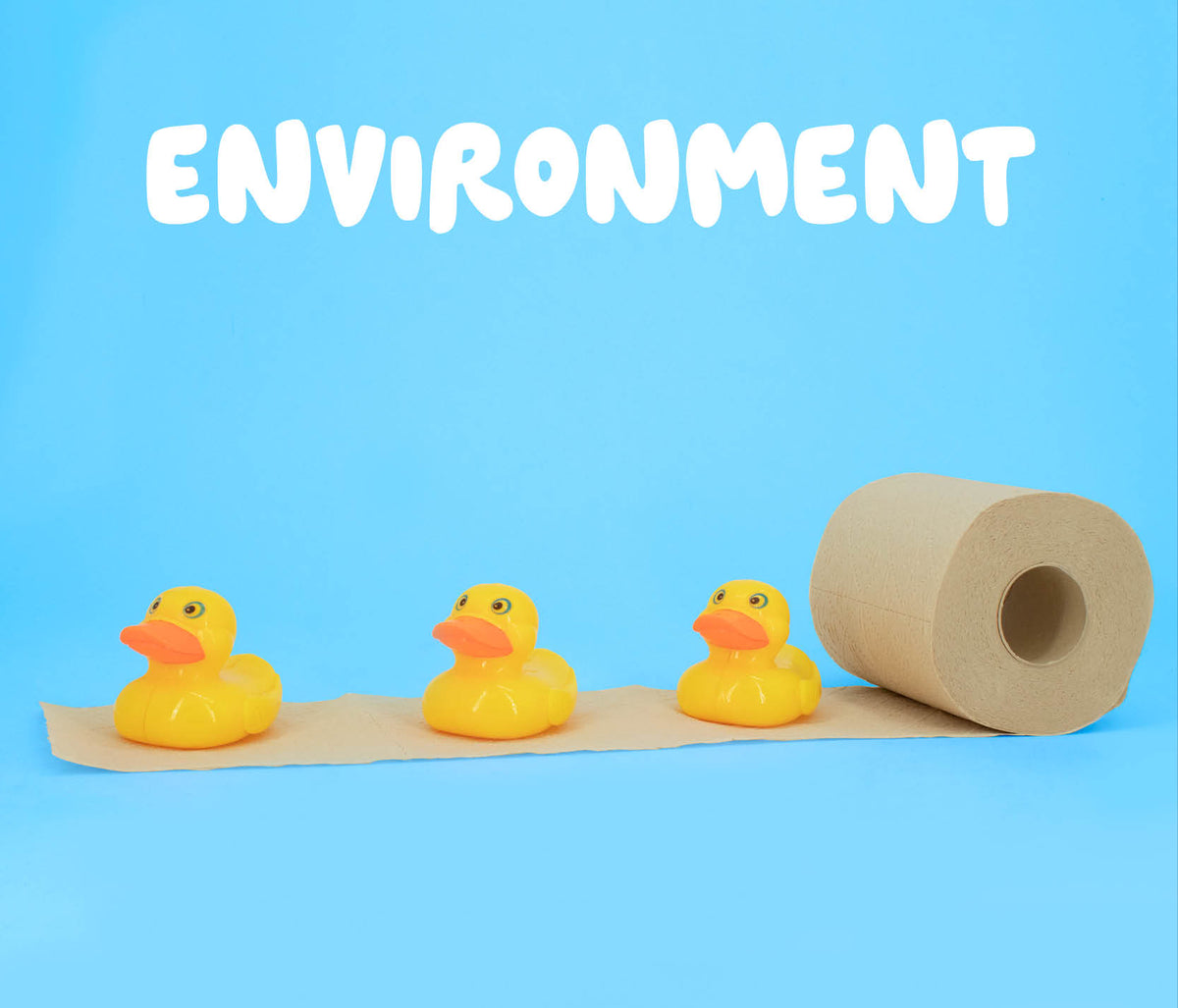 Three yellow rubber ducks on bamboo bobbi toilet paper, on a blue background with 'ENVIRONMENT' text.