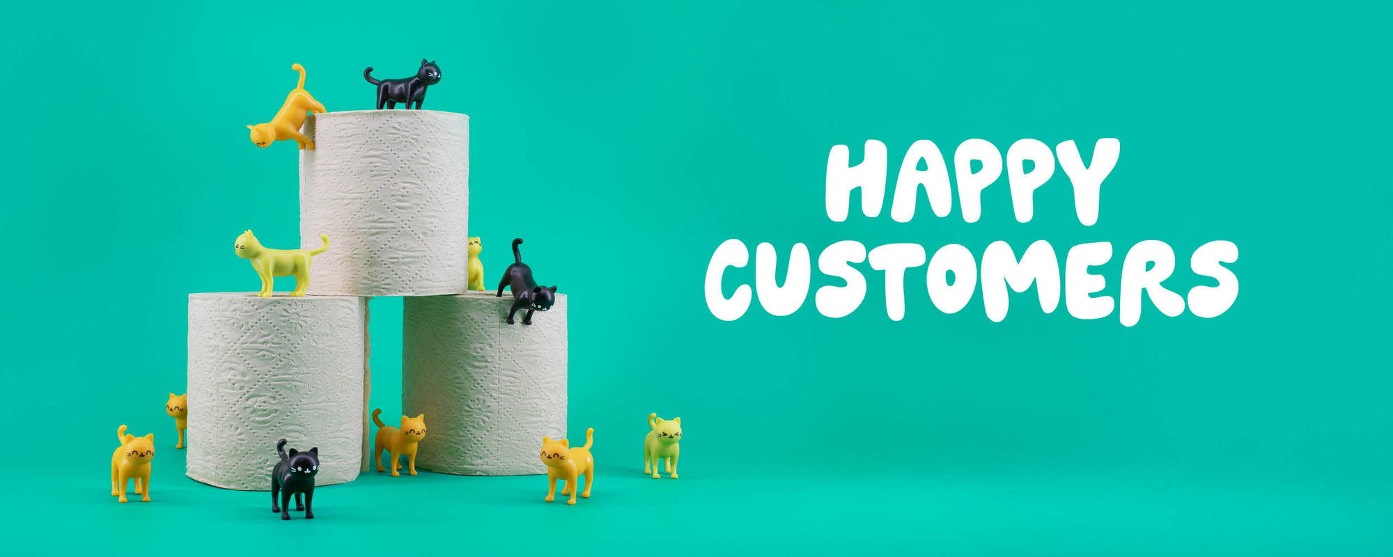 Cats climbing over toilet roll with text 'HAPPY CUSTOMERS'